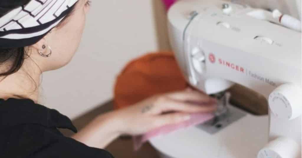Ethical Brand Directory Blog | Top 10 Tips for Going Green | Woman with a sewing machine.