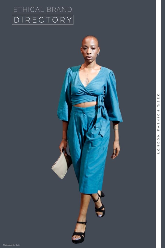 Ade wearing a teal wrap top and cropped trousers by Jenerous, carrying a nude clutch by The Morphbag, ethical brands at LFW