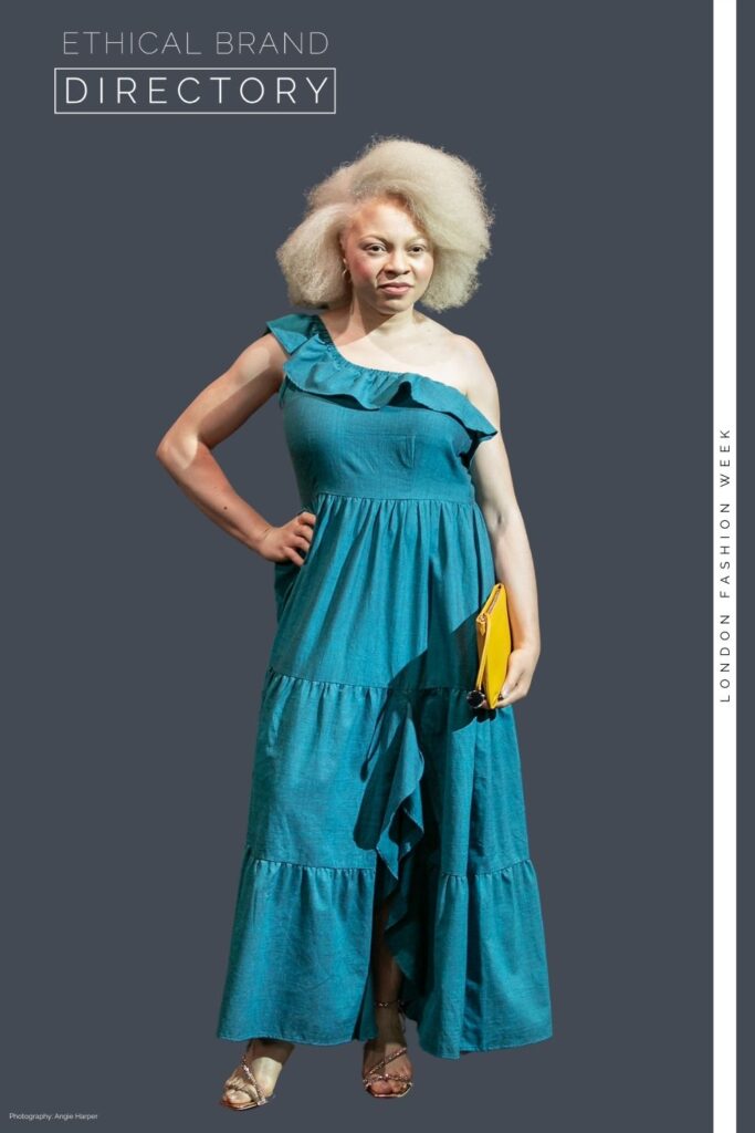 Christelle wearing ethically made one-shouldered teal maxi dress by Jenerous, carrying a mustard yellow clutch by The Morph Bag. Styled by Roberta Lee at London Fashion Week 