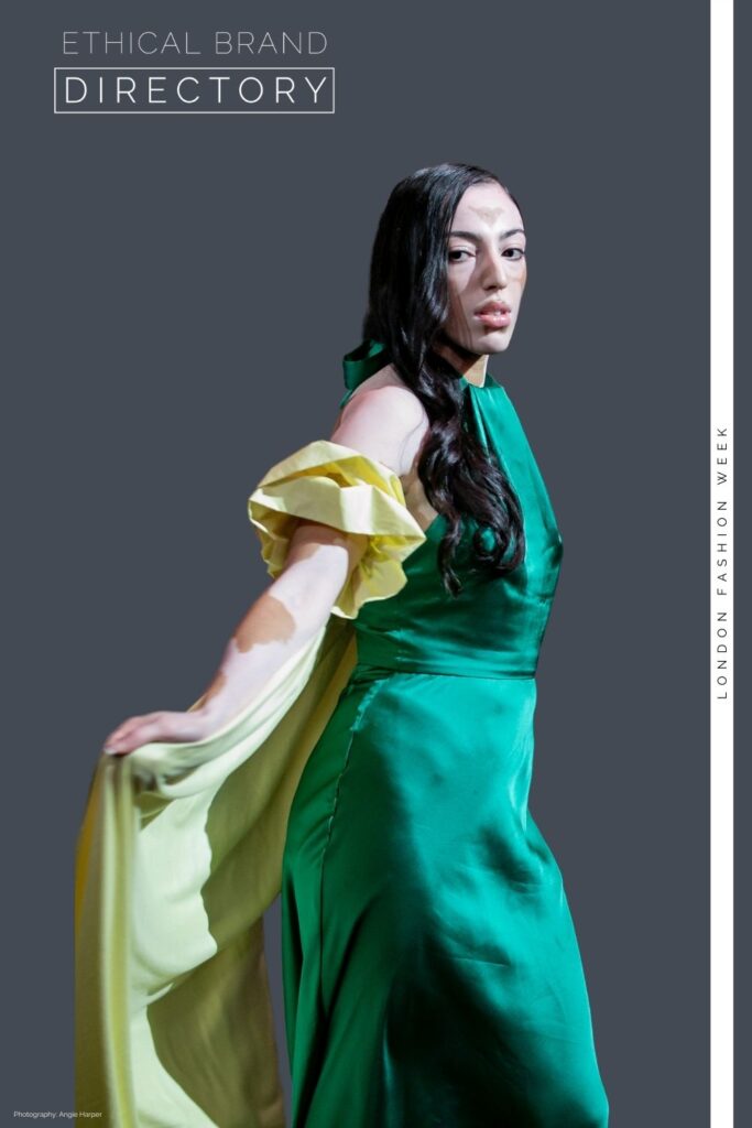Jasroop  from Zebedee wearing a green evening dress with a yellow cape by Sanyukta Shrestha, Styled by Roberta Lee for London Fashion Week. 
